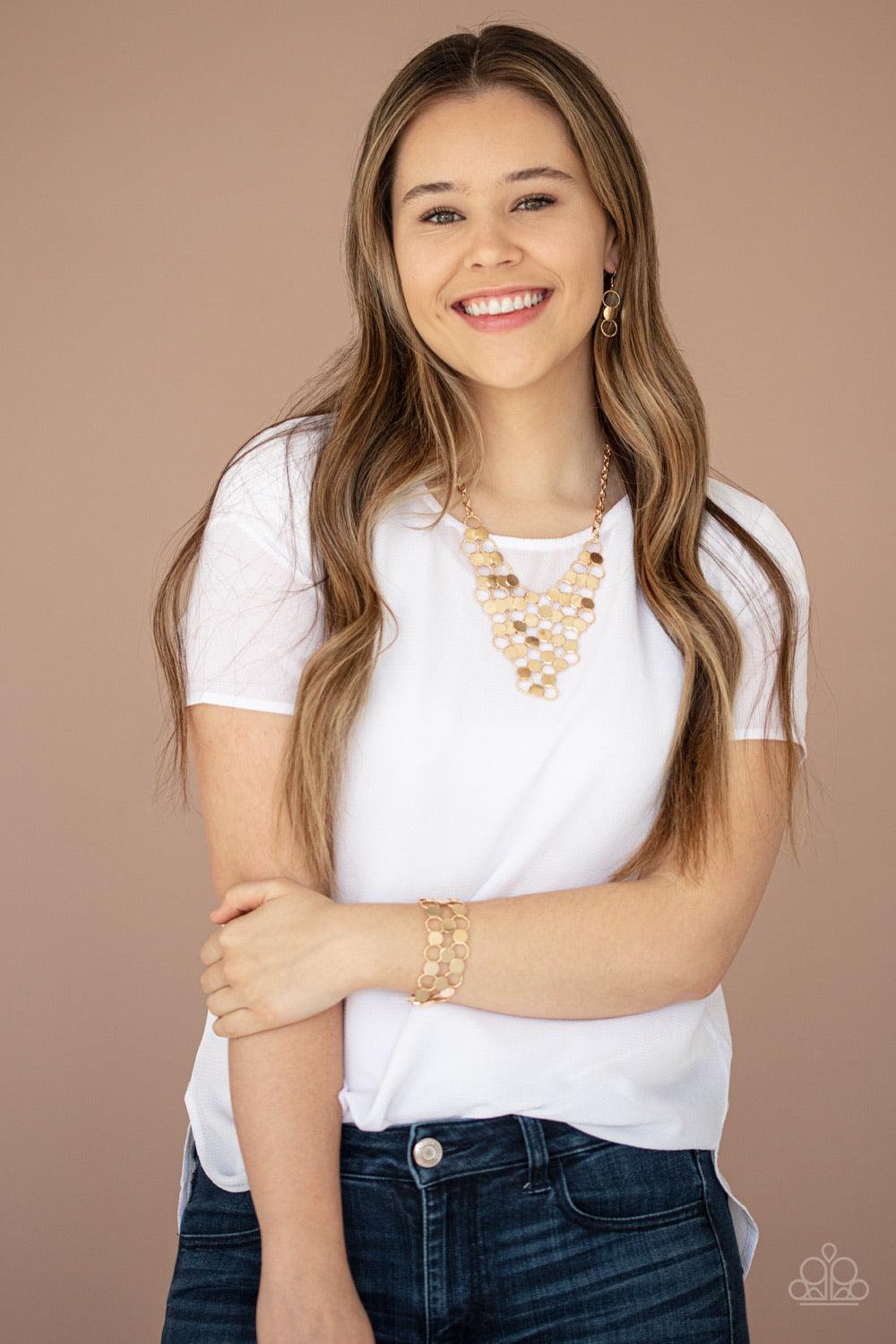 Paparazzi Accessories Net Result - Gold An interlocking net of textured gold rings and reflective gold discs link into a dramatically netted fringe below the collar. Features an adjustable clasp closure. Jewelry