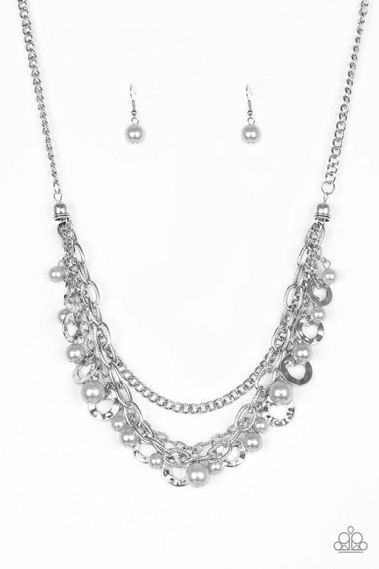 Paparazzi Accessories Hoppin Hearts - Silver Three rows of mismatched silver chains layer below the collar. Infused with airy heart cut-out centers, delicately hammered silver discs and pearly silver beads swing from the bottom of the lowermost chain, cre