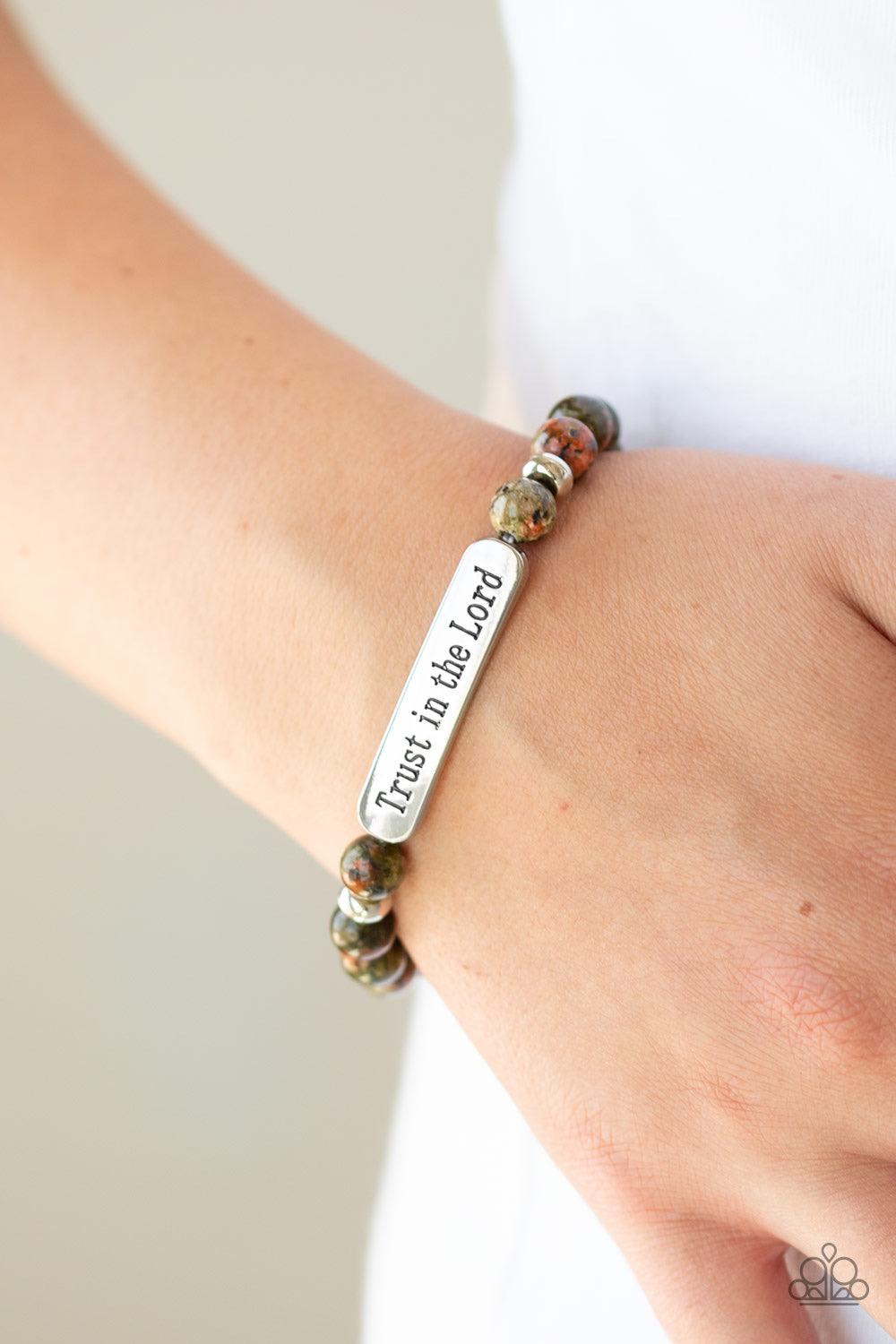Paparazzi Accessories Trust Always - Multi Infused with dainty silver accents, a collection of glassy stone beads and a shimmery silver frame stamped in the phrase, "Trust in the Lord", are threaded along a stretchy band around the wrist for an inspiratio