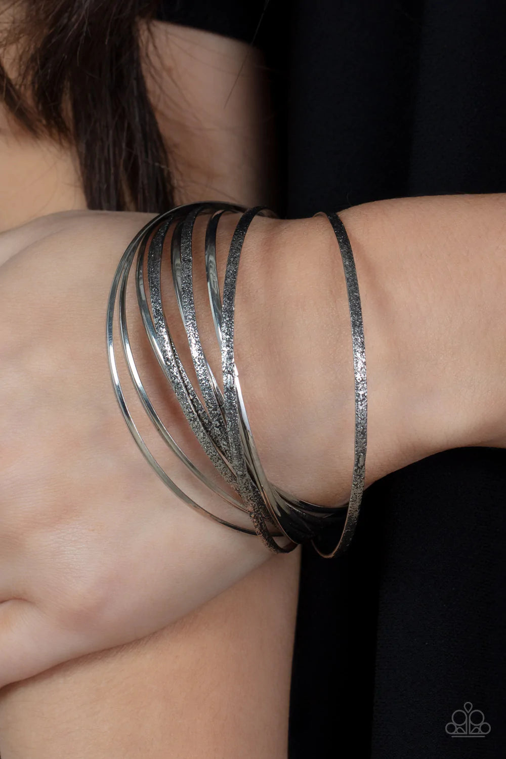 Paparazzi Accessories Suddenly Synced - Silver Rustic textured silver and shiny bangles create a tinkling musical chime as they link together rhythmically around the wrist. Sold as one individual bracelet. Jewelry
