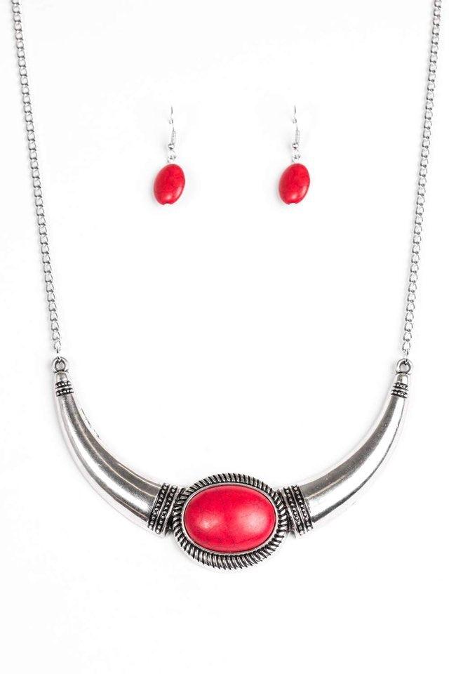 Paparazzi Accessories Cause A STEER - Red A red stone is pressed into the center of a bowing silver frame. Etched and dotted in shimmery textures, the dramatic pendant swings just below the collar for a simply seasonal look. Features an adjustable clasp c