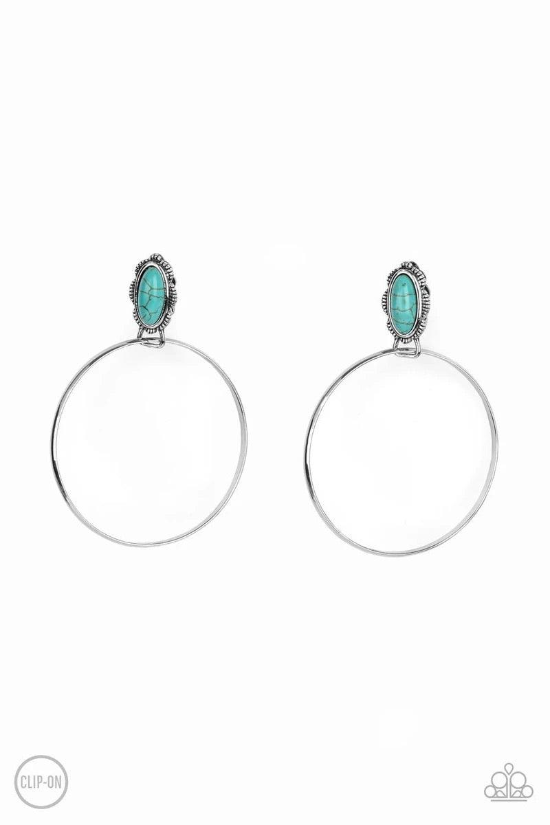 Paparazzi Accessories At Long LASSO - Blue *Clip-On A shimmery silver hoop is threaded through the bottom fitting of an earthy turquoise stone dotted floral silver frame, creating a whimsical display. Earring attaches to a standard clip-on fitting. Sold a