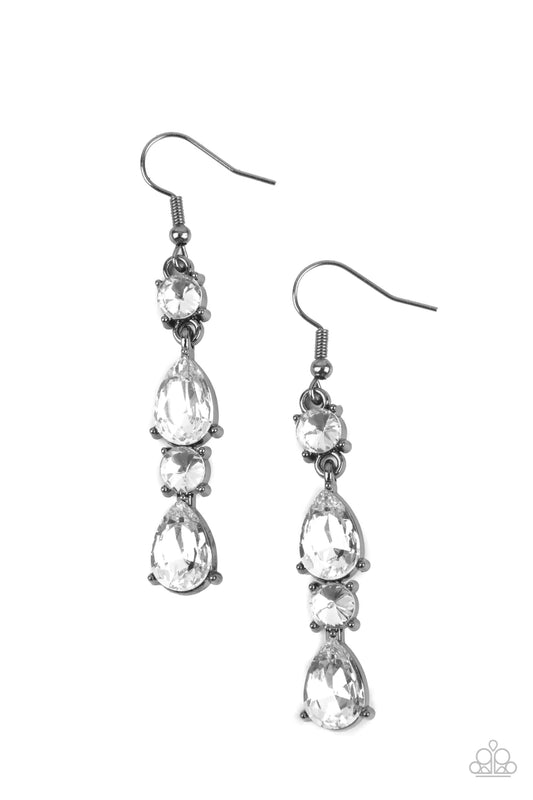 Paparazzi Accessories Raise Your Glass to Glamorous - Black A glamorous collection of brilliant white teardrop and round rhinestones encased in classic gunmetal pronged fittings stack together creating an irresistibly refined lure. Earring attaches to a s