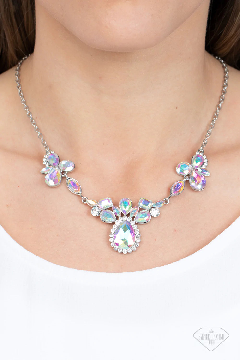 Paparazzi Accessories Intergalactic Icon - Multi Featuring emerald, oval, teardrop, and marquise style cuts, clusters of iridescent gems brilliantly sparkle below the collar for an out-of-this-world shimmer. Bordered in dainty white rhinestones, the cente