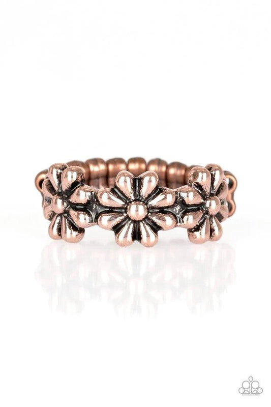 Paparazzi Accessories Daisy Dapper - Copper A row of dainty copper daisies connect across the finger, coalescing into a whimsical band. Features a dainty stretchy band for a flexible fit. Sold as one individual ring. Jewelry