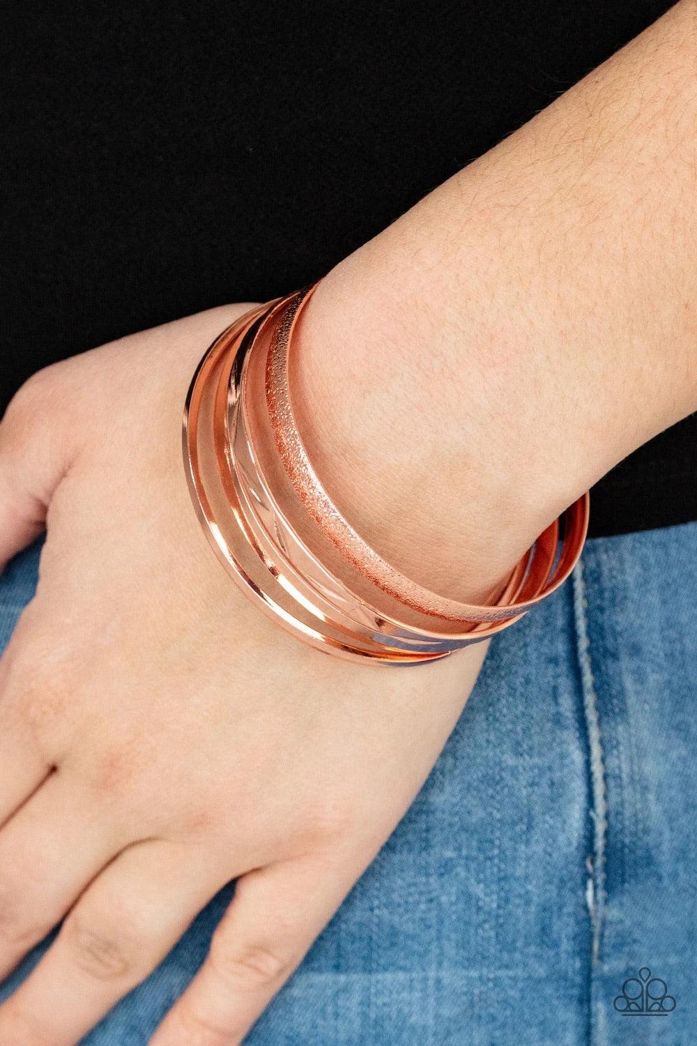 Paparazzi Accessories Stackable Style - Copper Varying in hammered, textured, and high sheen finishes, a mismatched collection of shiny copper bangles stacks across the wrist for a classic fashion. Jewelry