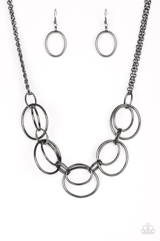 Paparazzi Accessories Urban Orbit - Black Doubled gunmetal hoops link below the collar for a bold industrial look. Features an adjustable clasp closure. Jewelry