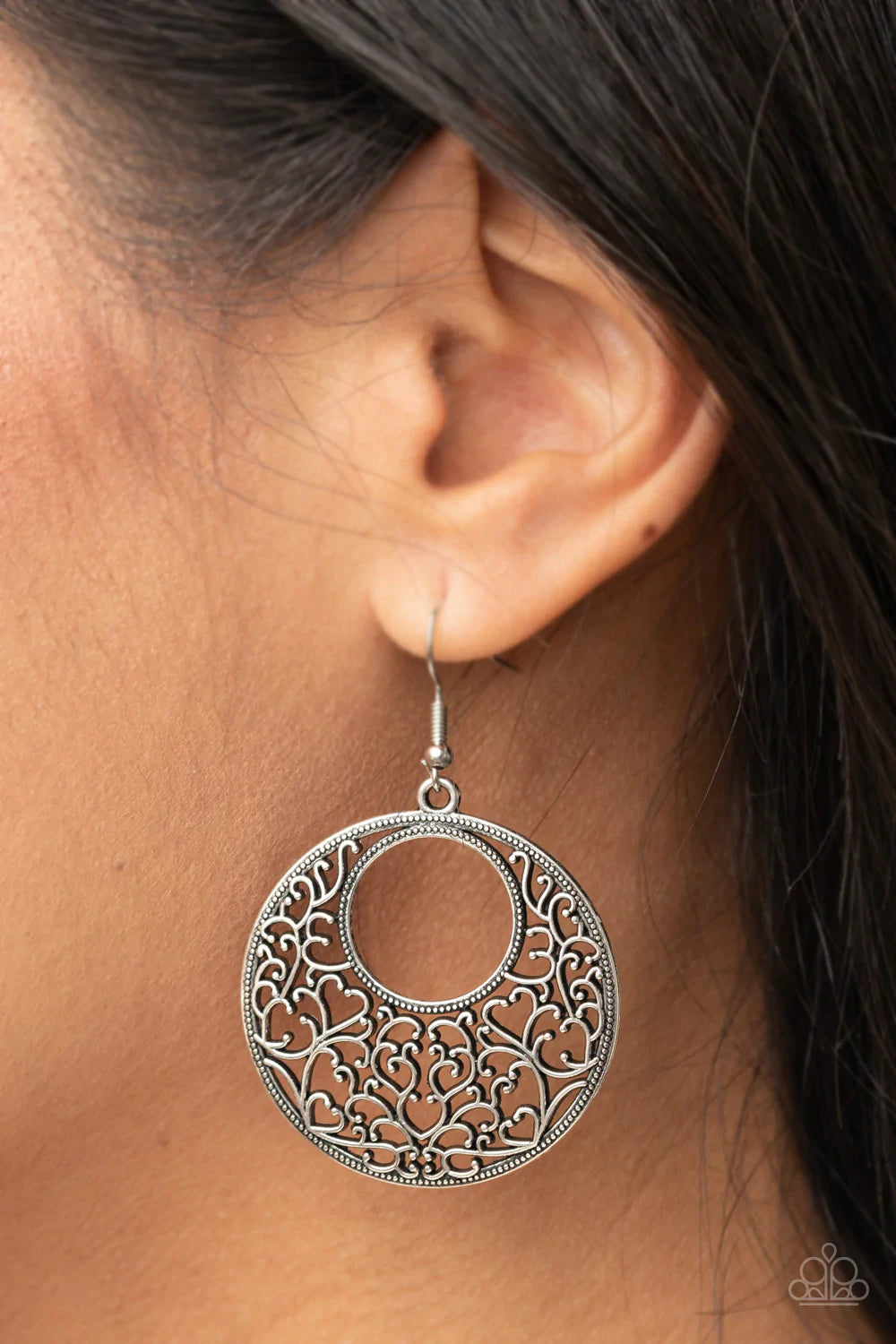 Paparazzi Accessories Vinegars Romance - Silver Brushed in an antiqued shimmer, vine-like filigree silver climbs the inside of a studded circular frame, creating a whimsical centerpiece. Earring attaches to a standard fishhook fitting. Sold as one pair of