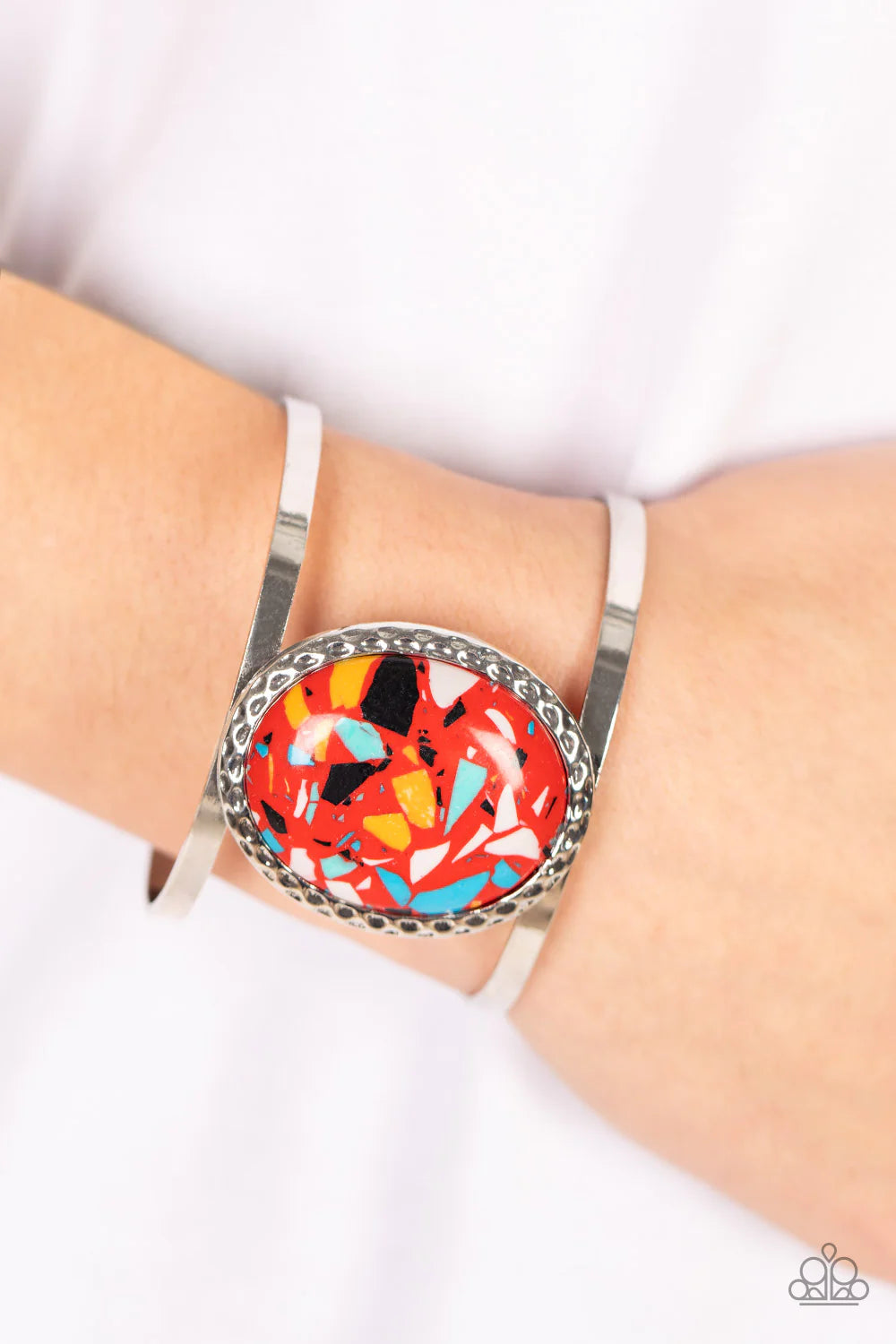Paparazzi Accessories Tantalizingly Terrazzo - Red Featuring a colorful terrazzo finish, an oversized red stone is pressed into the center of a hammered silver frame atop a layered silver cuff for a modern stone look. Sold as one individual bracelet. Jewe