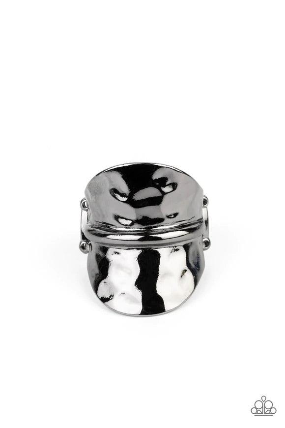 Paparazzi Accessories High Stakes Gleam - Black Featuring a high sheen, a hammered gunmetal disc, divided in half by a raised spine, floats up on each end for a gleaming high-stakes finish. Features a stretchy band for a flexible fit. Sold as one individu