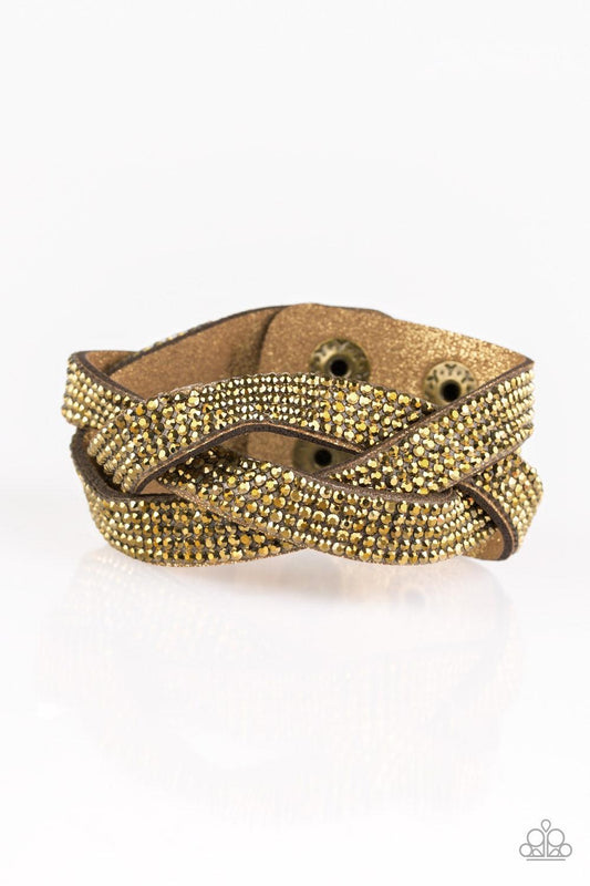 Paparazzi Accessories Nice Girls Finish Last - Brass Encrusted in row after row of glittery aurum rhinestones, three sparkling brown suede bands braid across the wrist for a sassy look. Features an adjustable snap closure. Sold as one individual bracelet.