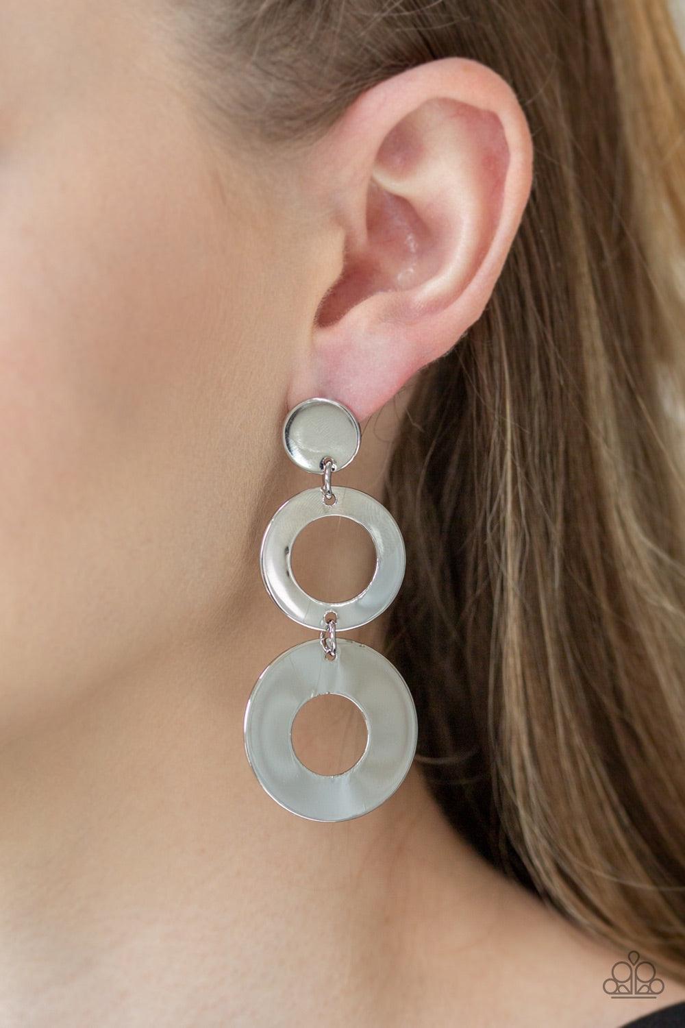 Paparazzi Accessories Pop Idol - Silver Attached to a silver fitting, glistening silver hoops link together, creating a shimmery lure. Earring attaches to a standard post fitting. Jewelry