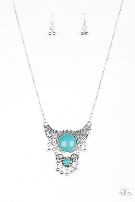 Paparazzi Accessories Summit Style - Blue Embossed in dotted and swirling details, a large silver crescent attaches to a smaller frilly frame, creating a stacked pendant. Swinging from the bottom of a lengthened silver chain, the tribal inspired pendant f