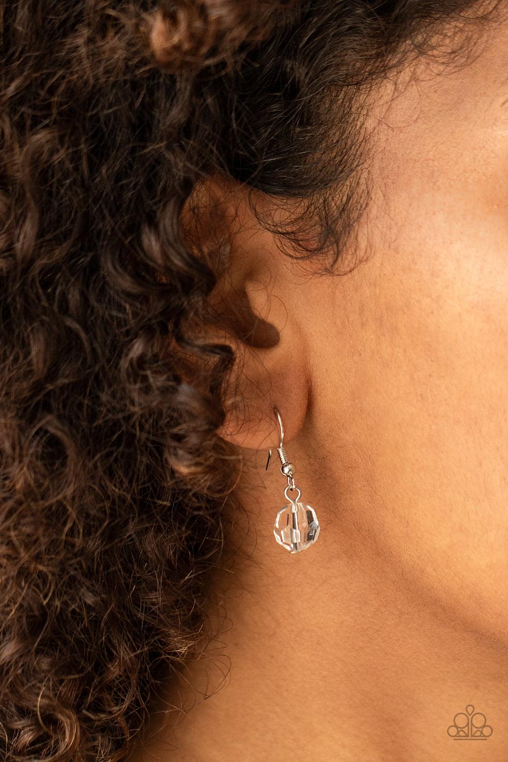 Paparazzi Accessories Malibu Masterpieces - White Varying in shape and size, glassy beads are knotted in place along a shiny black cording, creating a dazzling display across the chest. Features an adjustable clasp closure. Sold as one individual necklace
