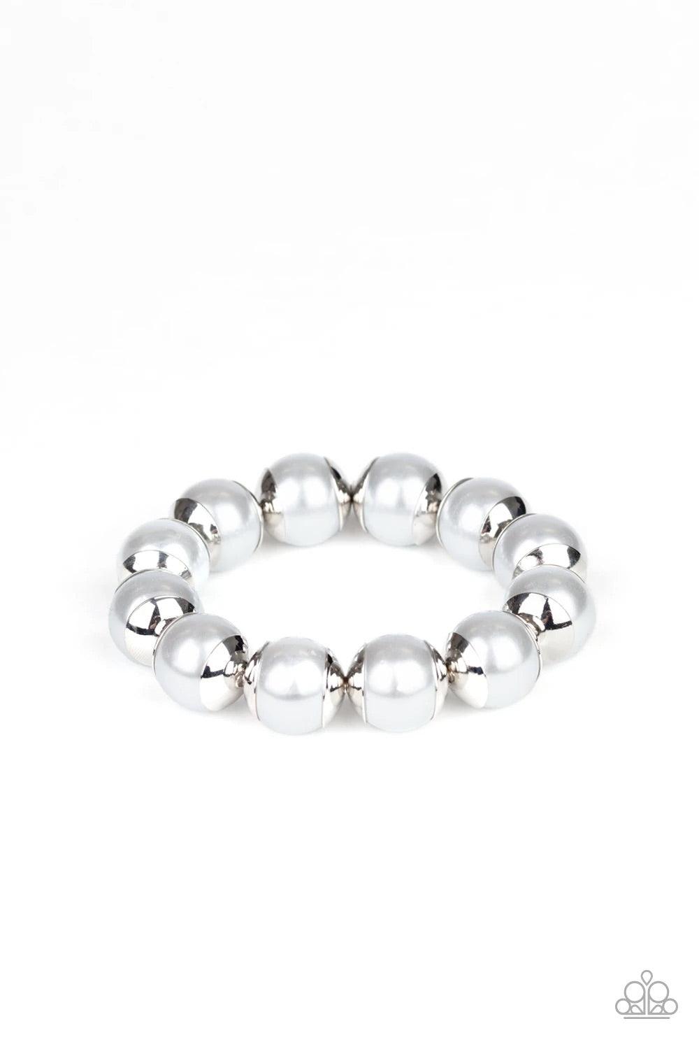 Paparazzi Accessories One Woman Show-STOPPER - Silver Capped in silver fittings, over-sized silver pearls are threaded along a stretchy band around the wrist for a refined look. Paparazzi Jewelry is lead-free and nickel-free. Sold as one individual bracel