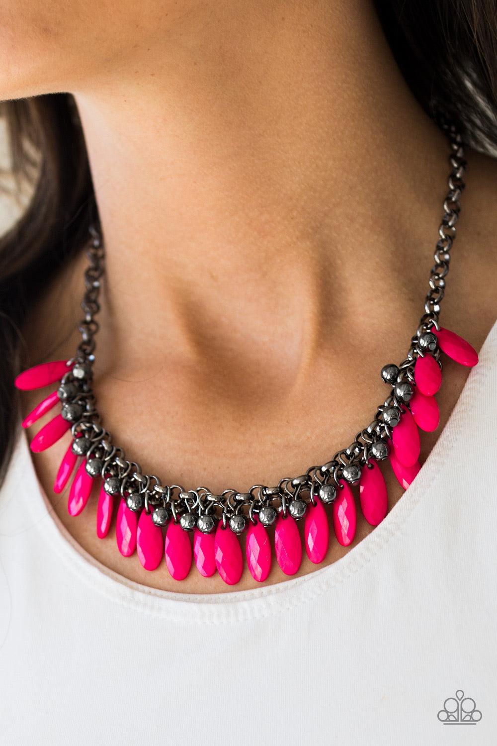 Paparazzi Accessories Jersey Shore - Pink Faceted pink teardrops and glistening gunmetal beads swing from the bottom of interlocking gunmetal chains, creating a spunky fringe below the collar. Features an adjustable clasp closure. Sold as one individual n