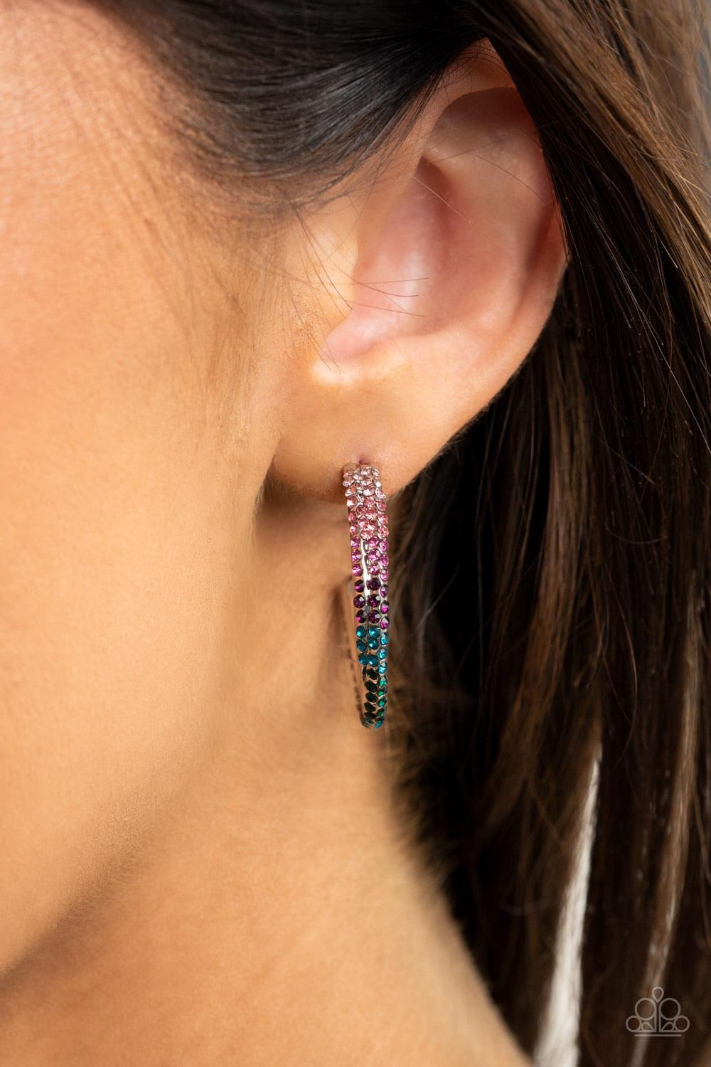 Paparazzi Accessories Trail Of Twinkle - Multi Two dainty rows of glittery multicolored rhinestone encrusted silver bars delicately overlap and twist into a hook shaped hoop for a refined flair. Earring attaches to a standard post fitting. Hoop measures a