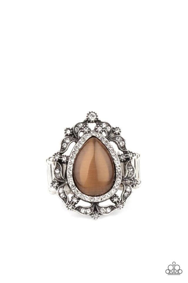Paparazzi Accessories Iridescently Icy ~Brown Dotted in glittery white rhinestones, leafy silver frames nestle around a glowing brown cat's eye teardrop center, creating a regal centerpiece atop the finger. Features a stretchy band for a flexible fit. Rin