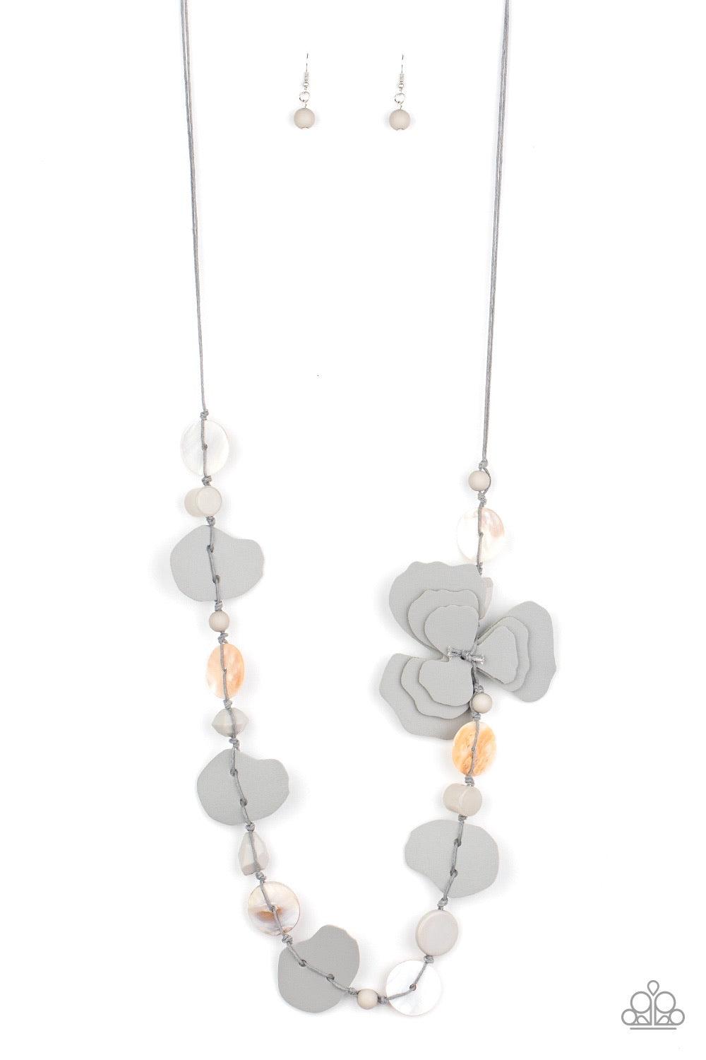 Paparazzi Accessories On Island Time - Silver A colorful compilation of shell-like discs, mismatched gray acrylic beads, and petal-like gray leather pieces knot along strands of gray cording across the chest. The ruffled pieces of leather stack into a whi