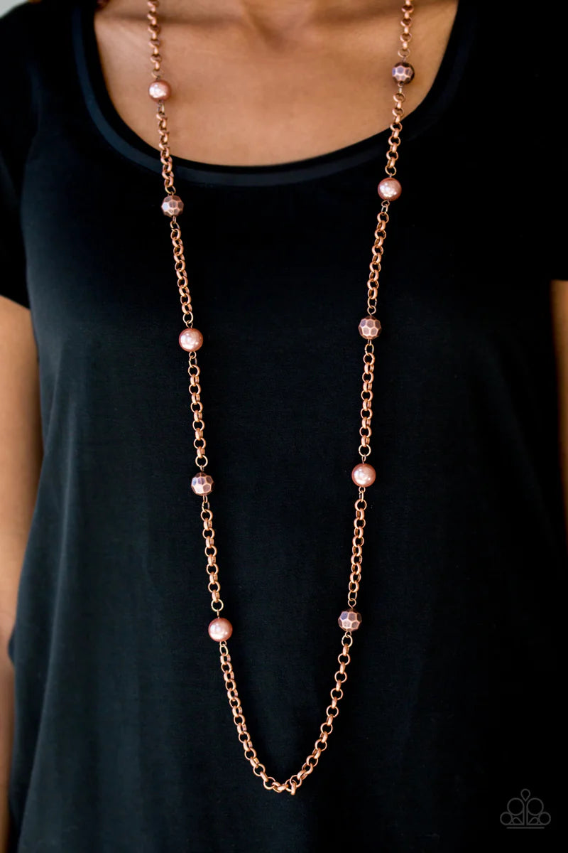 Paparazzi Accessories Showroom Shimmer - Copper Pearly and faceted copper beads trickle along a bold copper chain, creating a fierce tone on tone palette. Features an adjustable clasp closure. Sold as one individual necklace. Includes one pair of matching