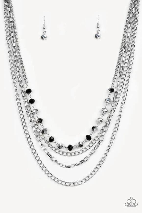 Paparazzi Accessories Extravagant Elegance - Multi Mismatched silver chains layer down the chest. Dipped in a metallic sheen, a strand of faceted black beads join below the collar for a glamorous look. Features an adjustable clasp closure. Sold as one ind