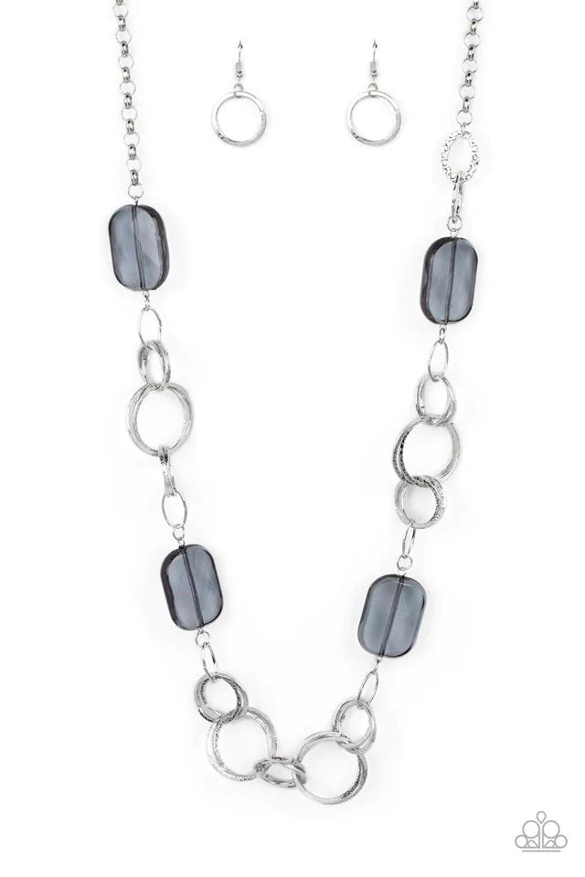 Paparazzi Accessories Stained Glass Glamour - Silver Featuring a faceted shimmer, oversized smoky beads give way to sections of delicately hammered silver hoops across the chest for a colorful flair. Features an adjustable clasp closure.