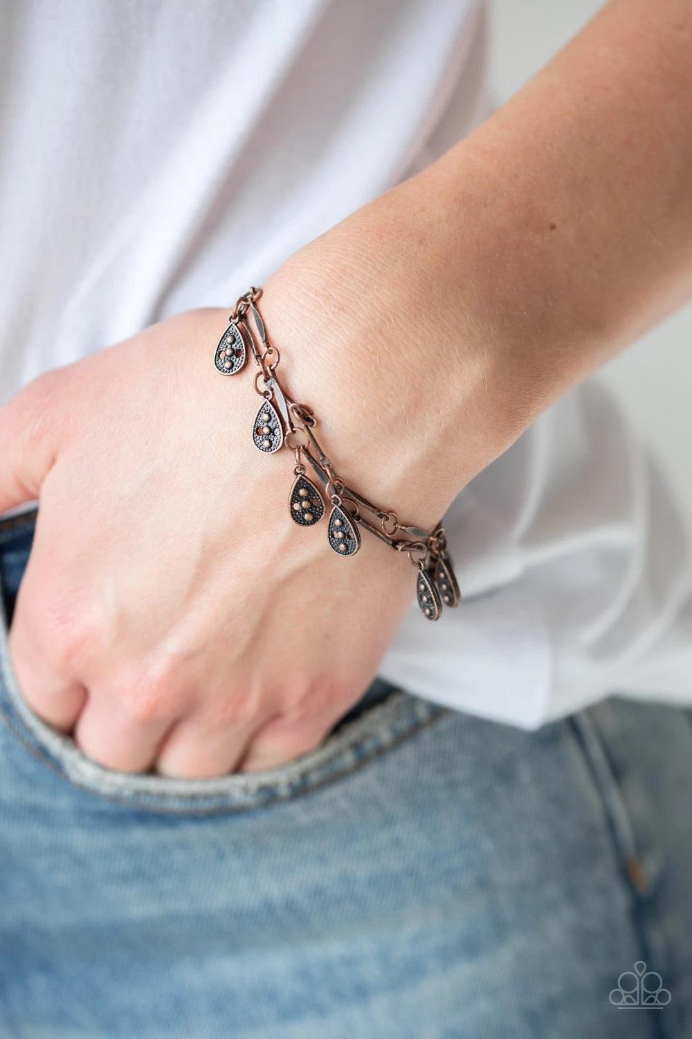 Paparazzi Accessories Gypsy Glee - Copper Glistening copper rods and ornate teardrops link around the wrist in two rows, creating a playful fringe. Features an adjustable clasp closure. Sold as one individual bracelet. Jewelry