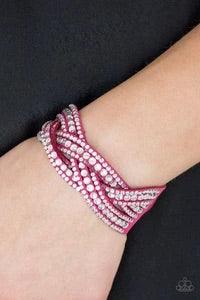 Paparazzi Accessories Bring on the Bling - Pink Varying in size, glassy white rhinestones are encrusted along interwoven pink suede bands, creating blinding shimmer across the wrist. Features an adjustable snap closure. Jewelry
