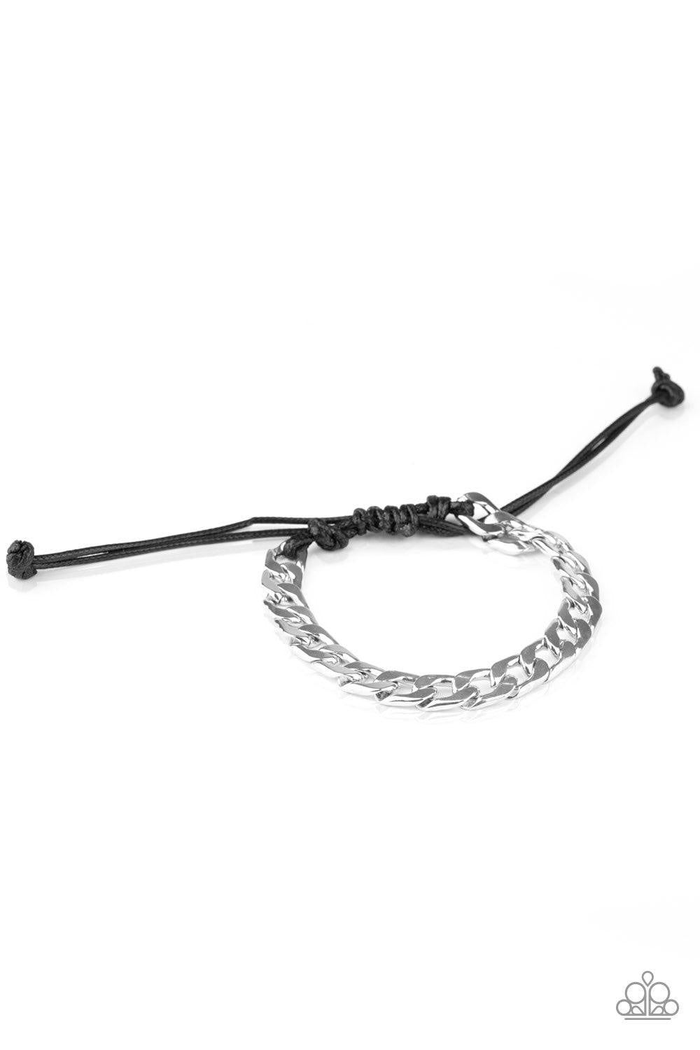 Paparazzi Accessories Score! - Silver Shiny black cording knots around the ends of a thick shiny silver curb chain that is wrapped across the top of the wrist for a versatile look. Features an adjustable sliding knot closure. Jewelry