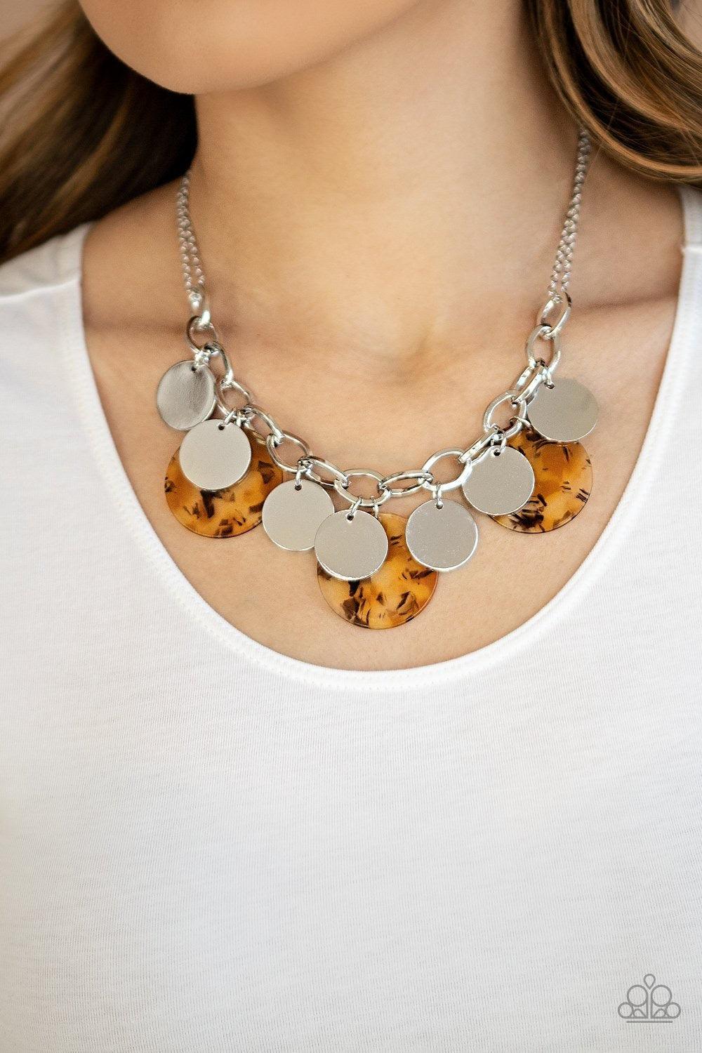 Paparazzi Accessories Confetti Confection - Yellow Attached to doubled silver chain, a playful collection of colorful acrylic discs and shiny silver discs swing from the bottom of a bold silver chain, creating a bubbly fringe below the collar. Features an
