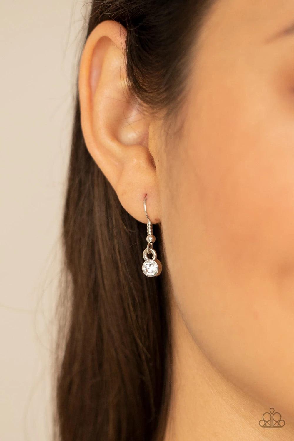 Paparazzi Accessories Everlasting Enchantment - Blue Bordered in glassy white rhinestones, glowing blue cat's eye stone frames delicately increase in size as they link below the collar, creating an enchanting display. Features an adjustable clasp closure.