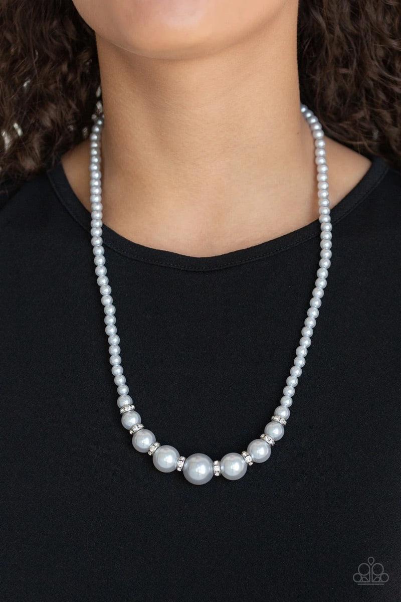 Paparazzi Accessories SoHo Sweetheart - Silver Threaded along an invisible wire, dainty silver pearls give way to an alternating collection of larger silver pearls and white rhinestone encrusted rings below the collar for a timeless sparkle. Features an a