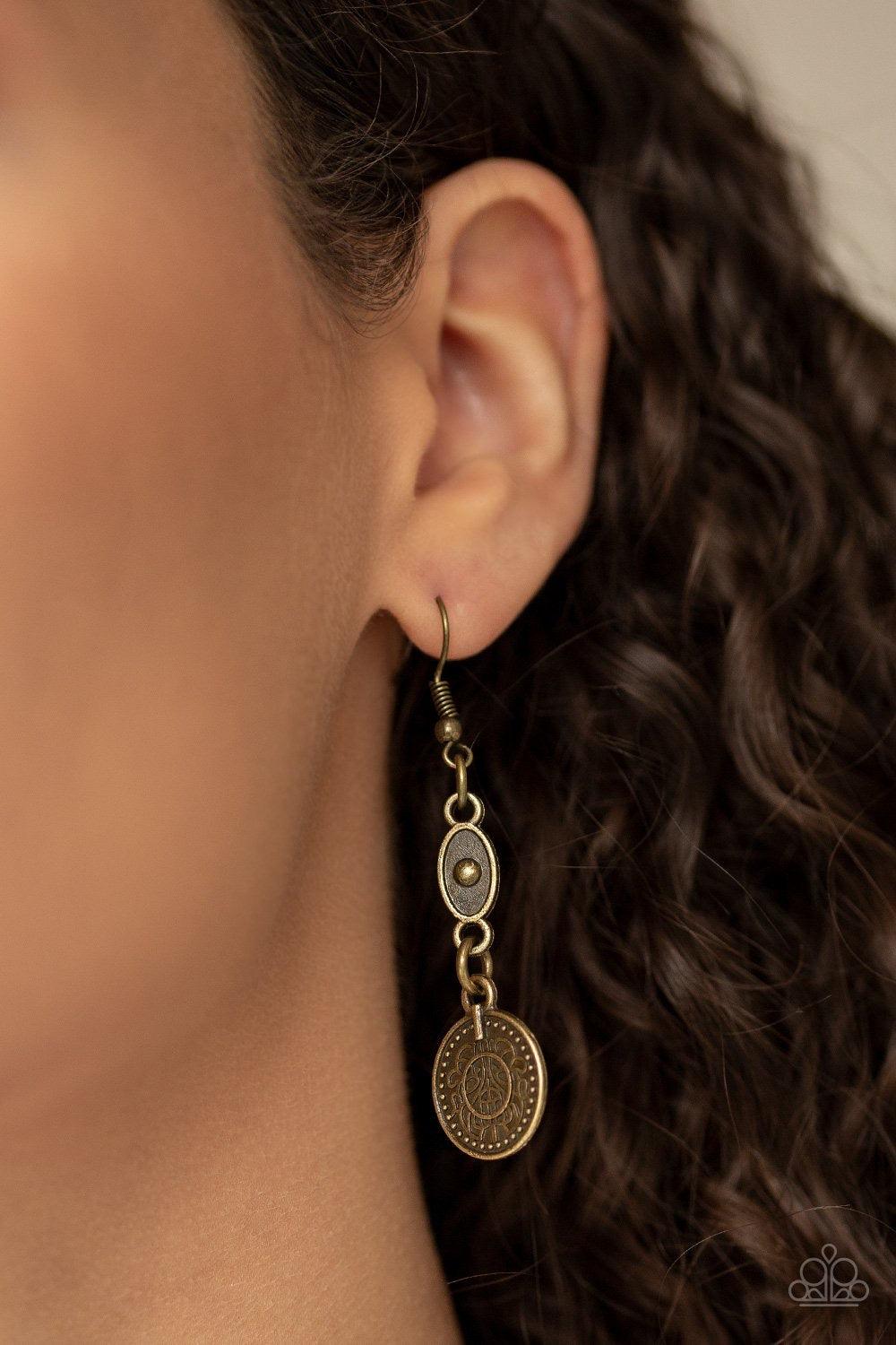 Paparazzi Accessories Treasure Temptress - Brass Brass coin-like accents dangle from the bottom of three ornate brass plates, creating a noise-making fringe below the collar. Features an adjustable clasp closure. Jewelry