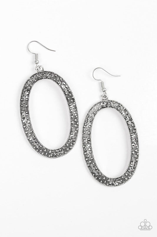 Paparazzi Accessories Rhinestone Rebel - Silver Glistening silver studs and glittery hematite rhinestones are sprinkled along an ornate silver hoop for an edgy look. Earring attaches to a standard fishhook fitting. Jewelry