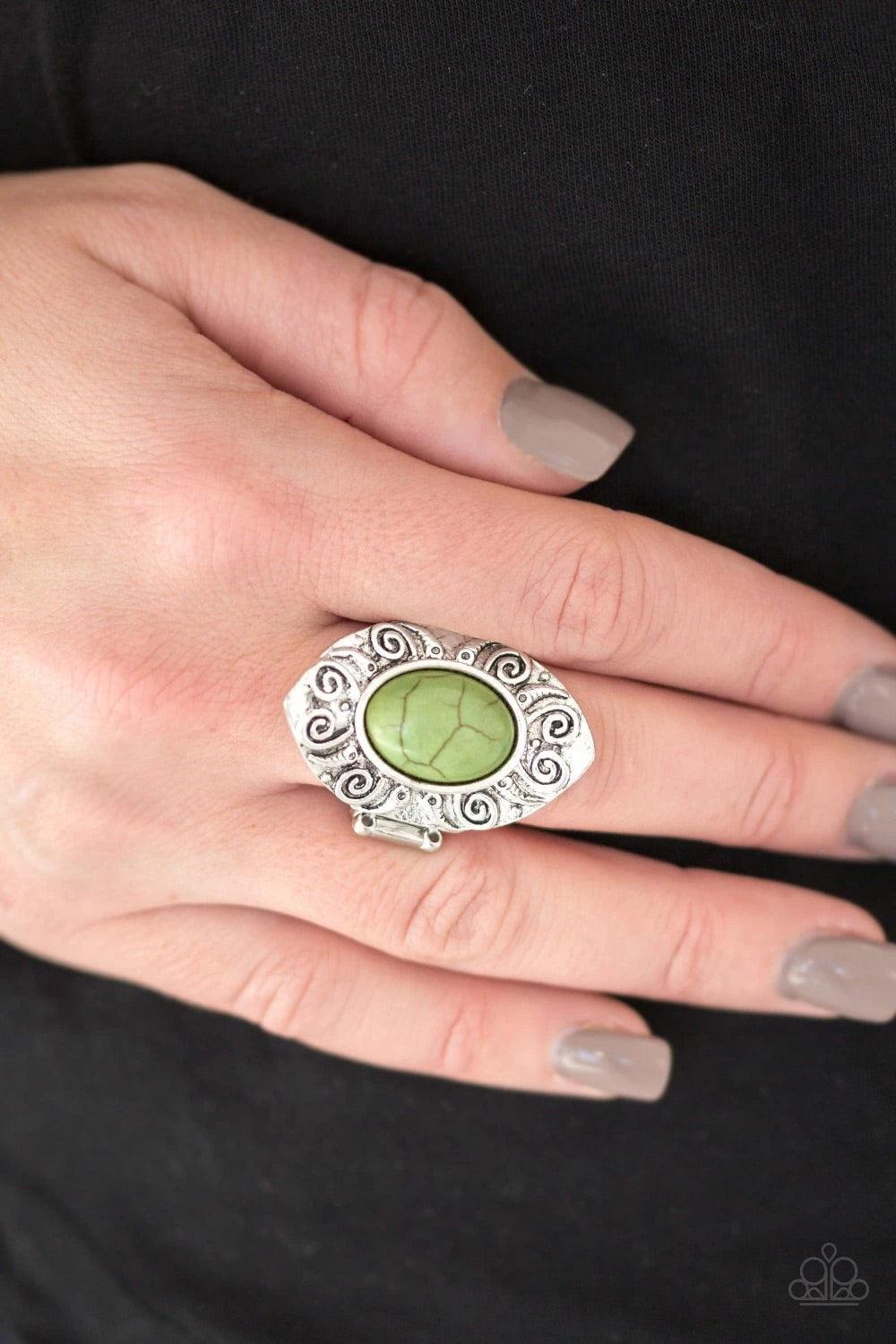 Paparazzi Accessories Mega Mother Nature - Green A refreshing green stone is pressed into a shimmery silver frame embossed in swirling details for an artisan inspired look. Features a stretchy band for a flexible fit. Sold as one individual ring. Jewelry