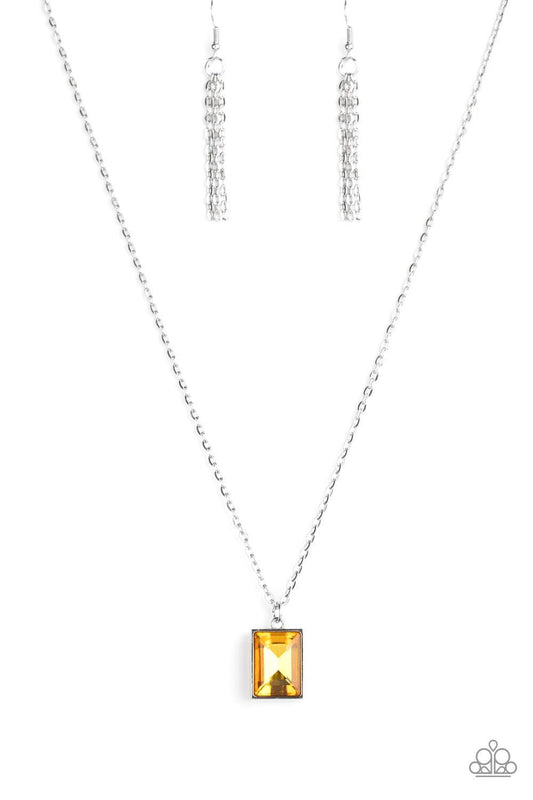 Paparazzi Accessories Pro Edge - Yellow Featuring an emerald style cut, a faceted yellow gem is pressed into a sleek silver frame at the bottom of a dainty silver chain below the collar for an edgy look. Features an adjustable clasp closure. Sold as one i