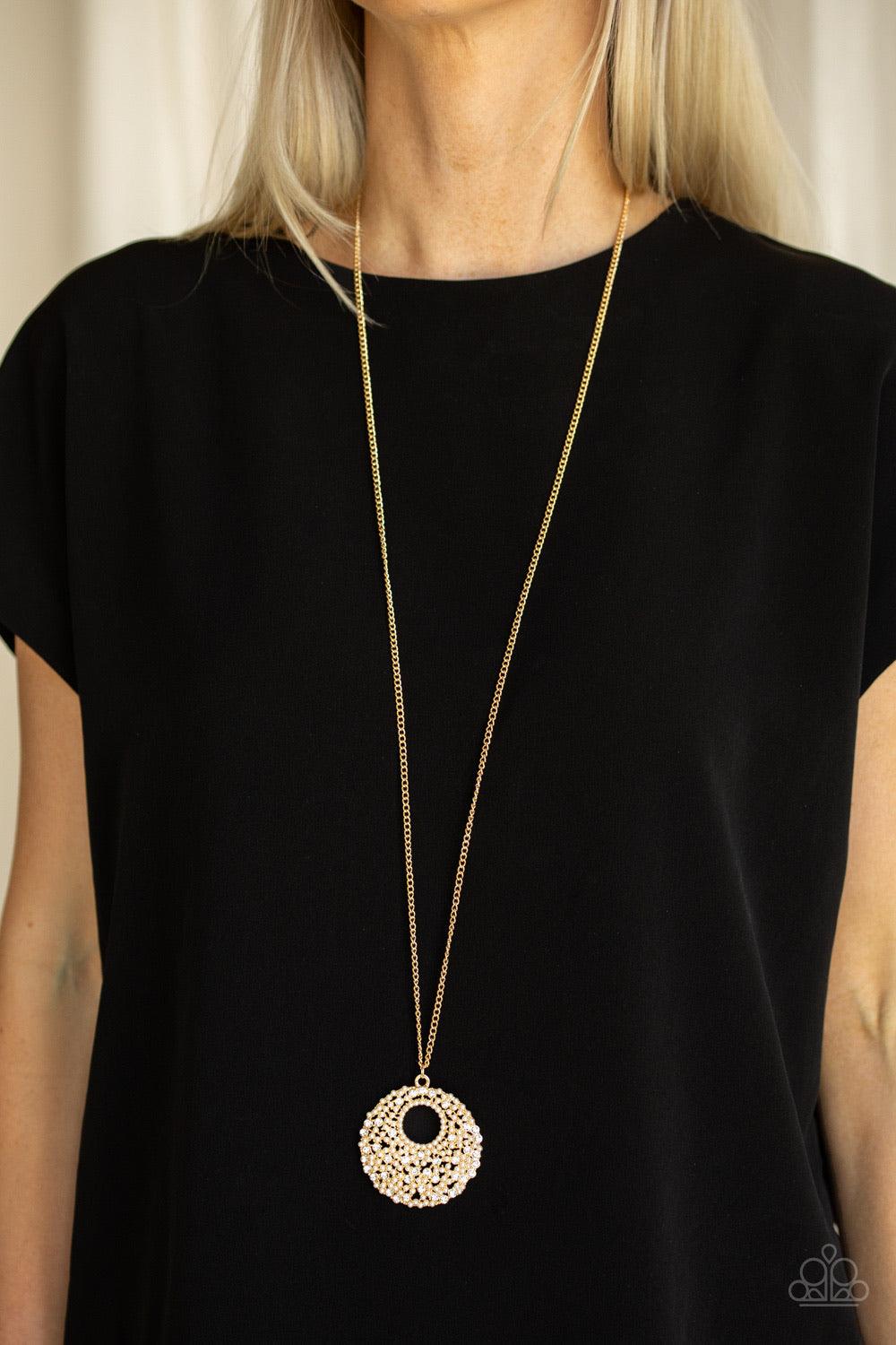 Paparazzi Accessories Pearl Panache - Gold A scatter of dainty white pearls and glassy white rhinestones coalesce into a dramatic pendant at the bottom of a lengthened gold chain for a glamorous look. Features an adjustable clasp closure. Sold as one indi