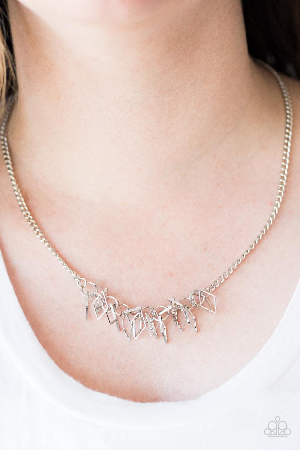 Paparazzi Accessories Beast Mode - Silver A thick silver chain gives way to a clustered fringe below the collar. Featuring a shiny finish, dainty diamond-shaped silhouettes swing from the bottom of the chain, creating a fierce fringe. Features an adjustab