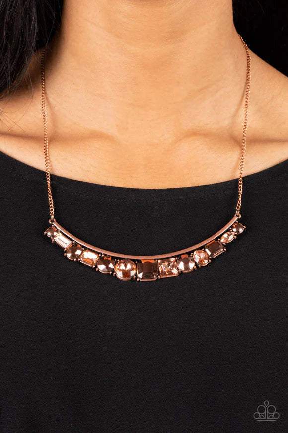 Paparazzi Accessories The Only SMOKE-SHOW in Town - Copper Featuring round, emerald, oval, and square cuts, a glitzy collection of copper aurum and coppery rhinestones alternates along the bottom of a curved copper rod. The sparkly compilation attaches to