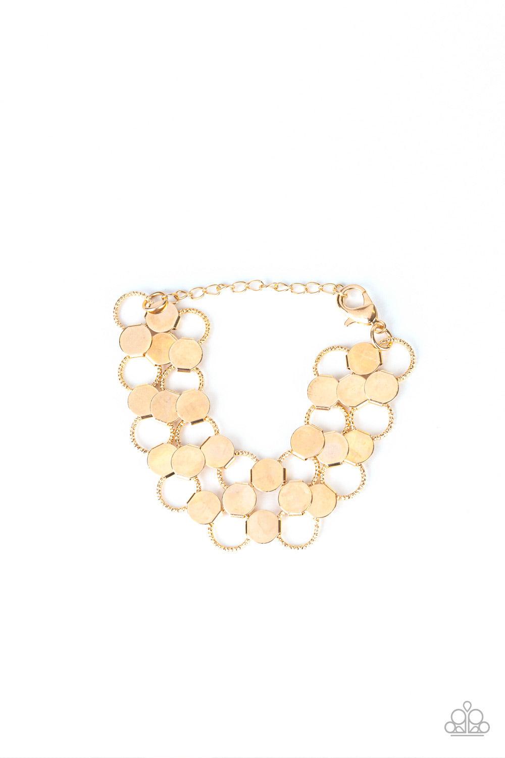 Paparazzi Accessories Cast A Wider Net - Gold Dotted with reflective gold discs, an interlocking net of textured gold rings link into edgy netted layers around the wrist. Features an adjustable clasp closure. Jewelry