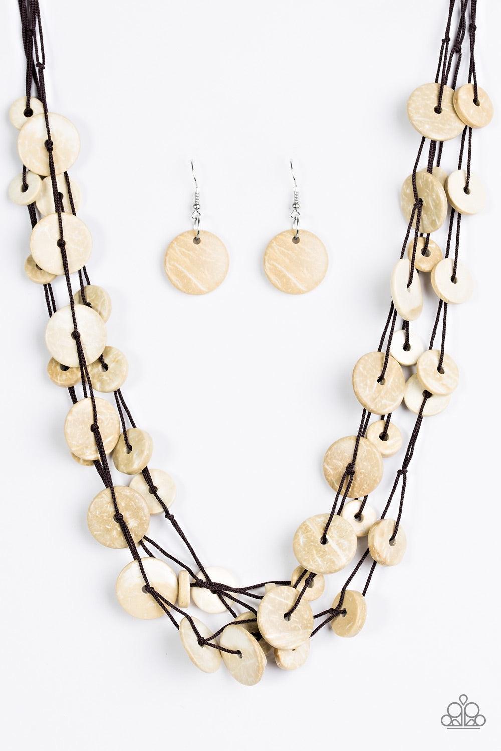 Paparazzi Accessories Bermuda Beach House - White Tinted in a neutral white finish, distressed wooden discs trickle along strands of knotted brown cording, creating colorful layers below the collar for a seasonal vibe. Features a button-loop closure. Jewe