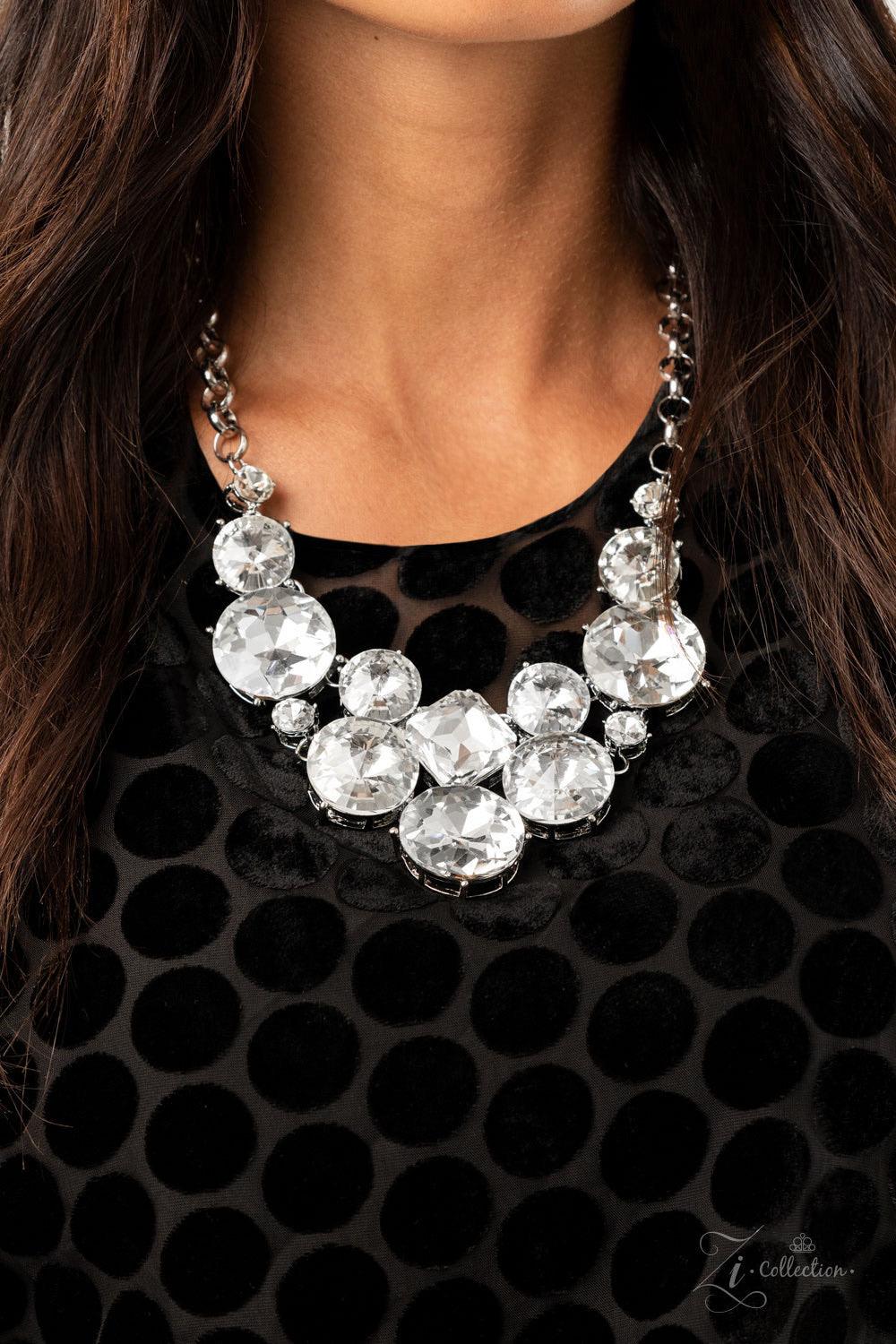 Paparazzi Accessories Unpredictable 💗💗ZiCollection $25💗💗 Varying in size and shape, a dramatic collision of oversized white rhinestones connect into an unapologetically glamorous statement piece below the collar. Attached to chunky silver links, the b