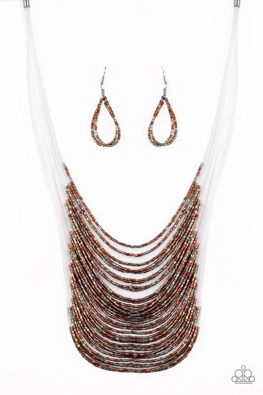 Paparazzi Accessories Catwalk Queen - Multi Strand after strand of metallic copper and gunmetal seed beads fall together to create a bold statement piece. Features an adjustable clasp closure. Sold as one individual necklace. Includes one pair of matching