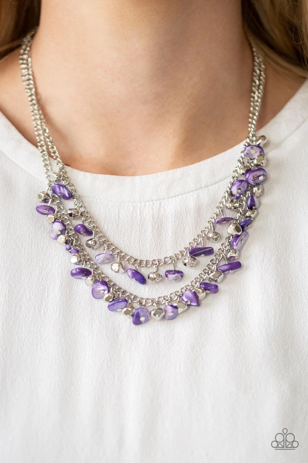 Paparazzi Accessories Pebble Pioneer ~Purple Two strands of vivacious purple pebbles and faceted silver beads swing from the bottoms of two layered chains, creating a colorful fringe below the collar. Features an adjustable clasp closure.Sold as one indiv