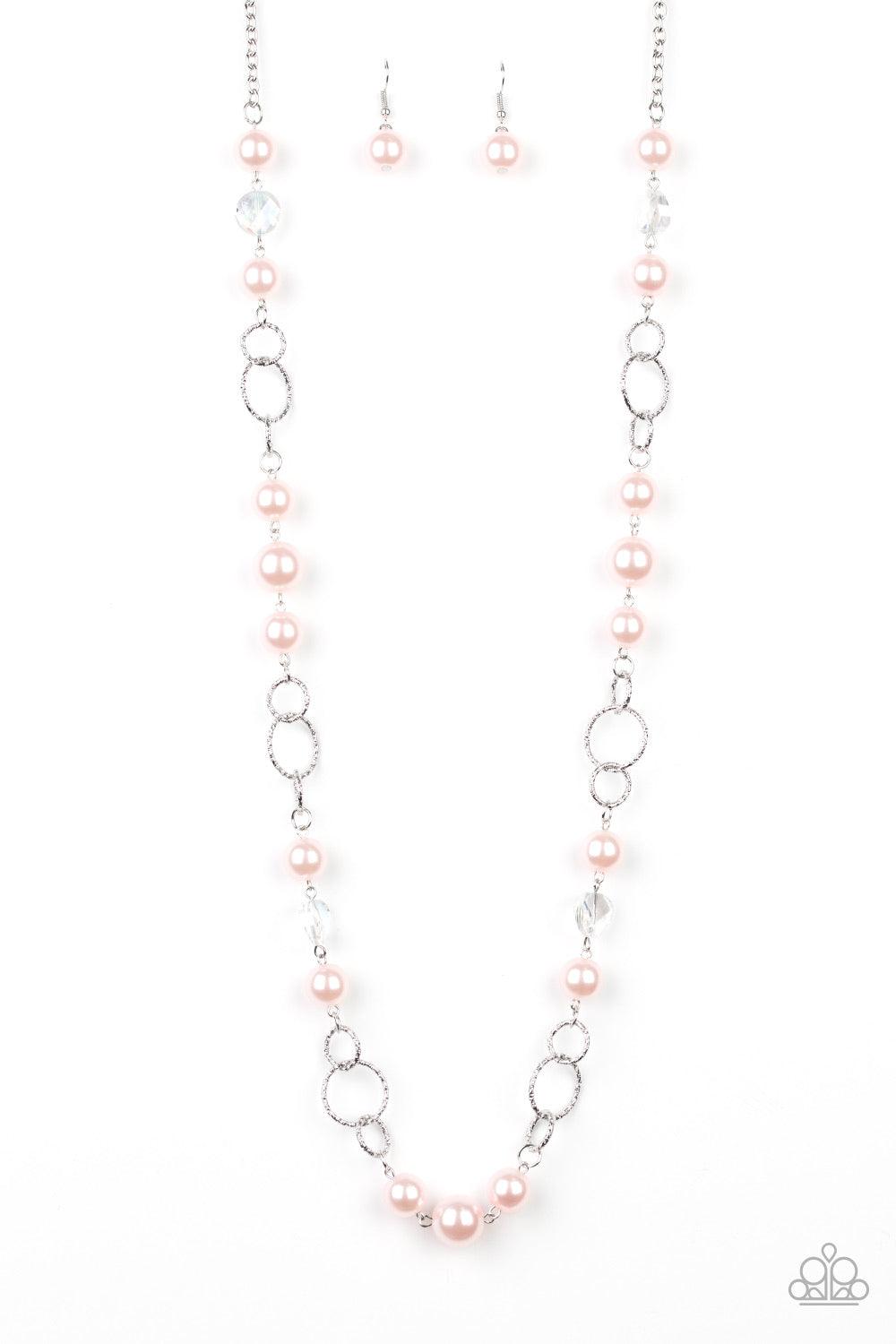 Paparazzi Accessories Prized Pearls - Pink A refined collection of glassy white gems, textured silver rings, and pearly pink beads drape across the chest for a timeless look. Features an adjustable clasp closure. Sold as one individual necklace. Includes