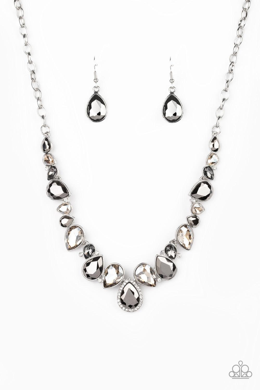 Paparazzi Accessories I Want It All - Silver A sassy combination of smoky, hematite, and metallic finished teardrop gems delicately link into a stunning piece below the collar. Dainty white rhinestones are scattered through the piece for unexpected hints