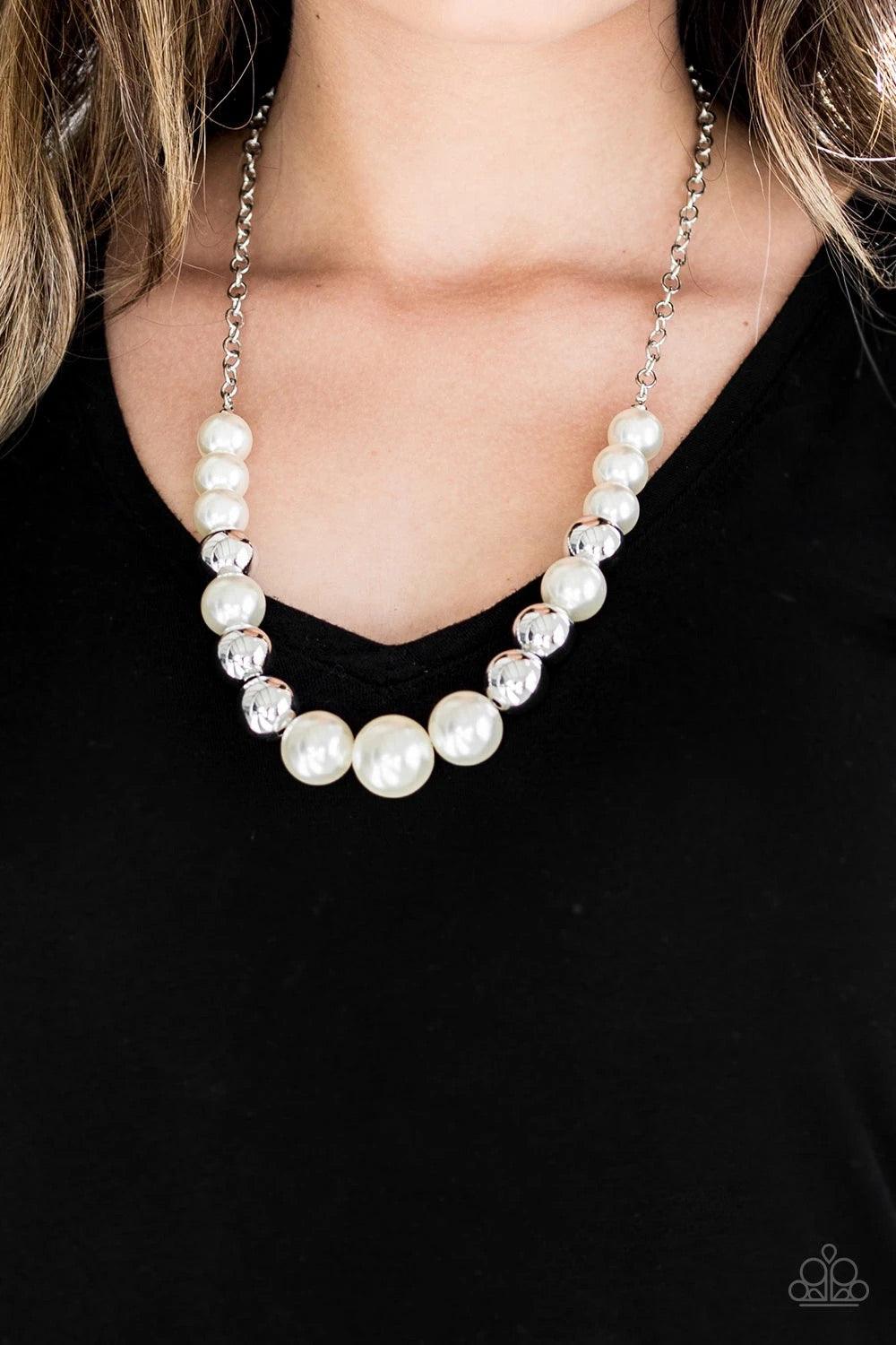 Paparazzi Accessories Take Note - White A collection of oversized silver and pearly white beads drape across the chest for a refined look. Features an adjustable clasp closure. Sold as one individual necklace. Includes one pair of matching earrings. Jewel