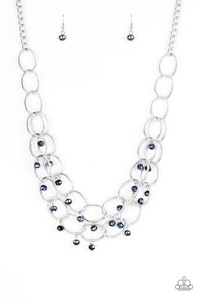 Paparazzi Accessories Yacht Tour - Blue Metallic blue crystal-like beads swing from two layers of oversized silver links below the collar for a refined look. Features an adjustable clasp closure. Sold as one individual necklace. Includes one pair of match