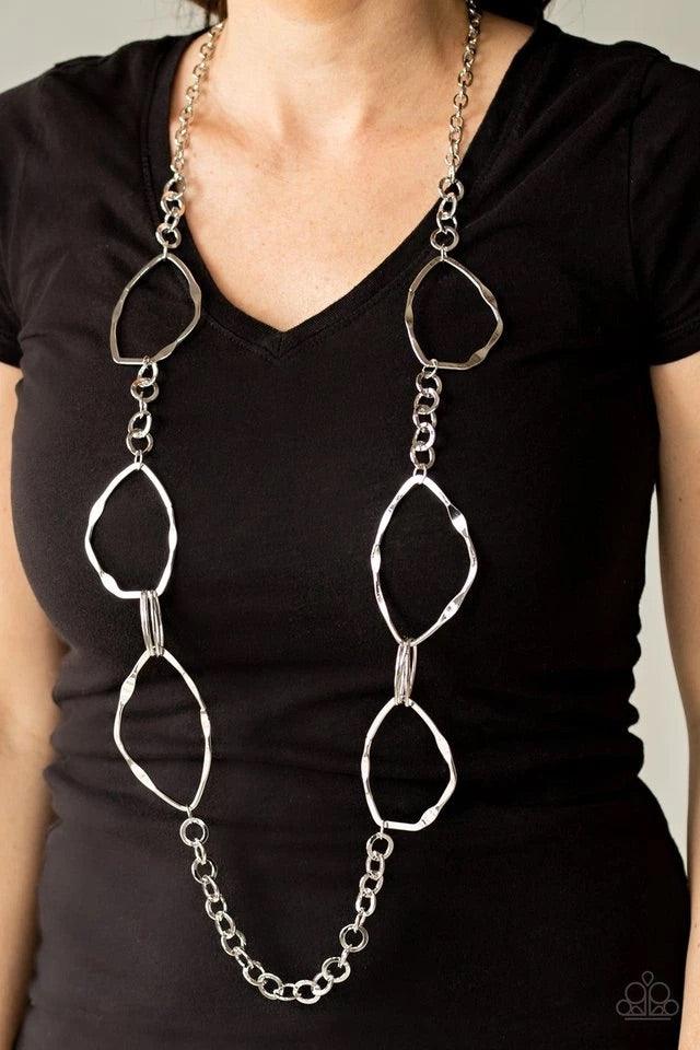 Paparazzi Accessories Abstract Artifact - Silver Mismatched sections of bold silver links, silver ovals, and flattened asymmetrical frames link across the chest for an abstract look. Features an adjustable clasp closure. Sold as one individual necklace. I