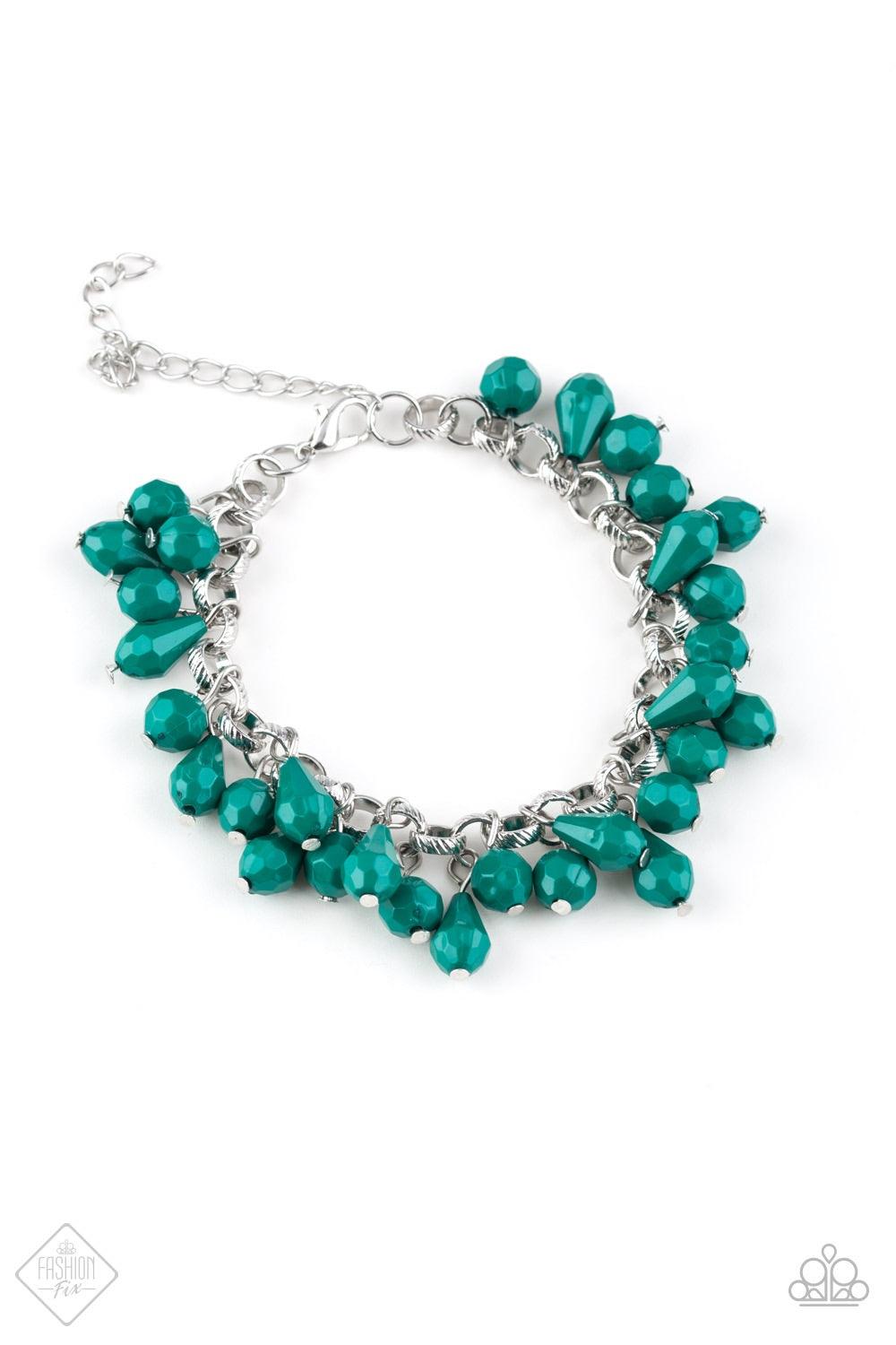 Paparazzi Accessories Malibu Masquerade - Green Featuring round and teardrop shapes, clusters of faceted Quetzal Green beads swing from a shimmery silver chain, creating a playful fringe around the wrist. Features an adjustable clasp closure. Jewelry